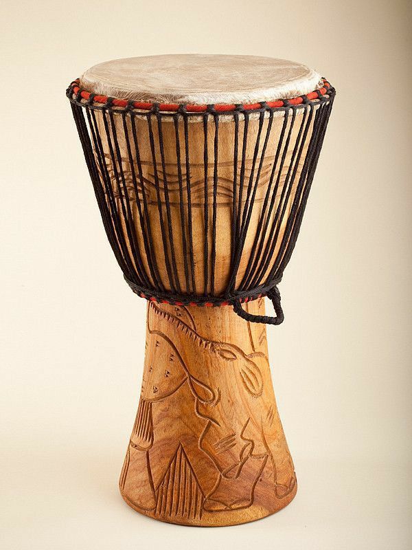 Traditional carved djembe drum